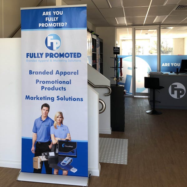 A single pull up banner located in an office reception area. Signage to showcase the business.