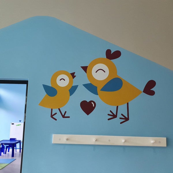 Cutout vinyl graphics applied to wall.