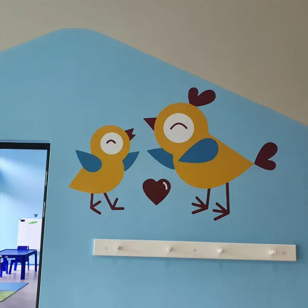 Cutout vinyl graphics applied to wall.