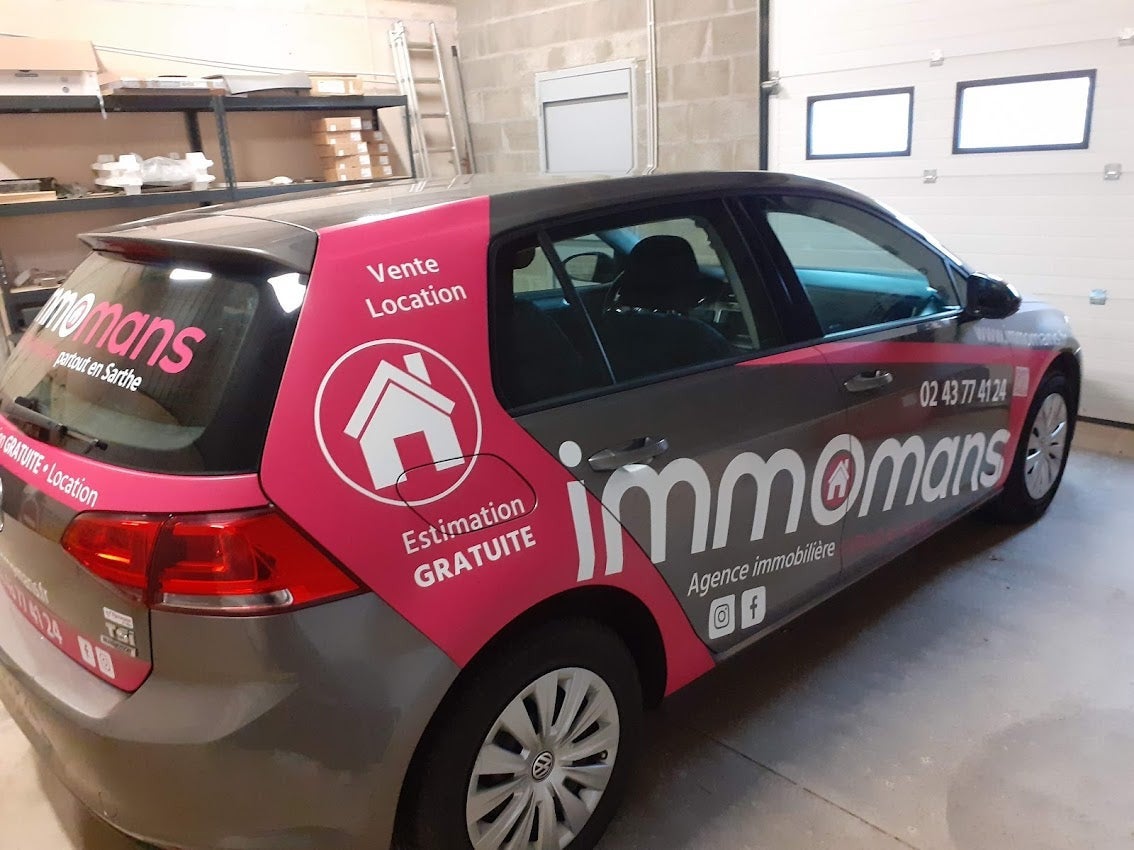 Habillage d'un véhicule pour Immomans installé sur Le Mans par Signarama Le Mans