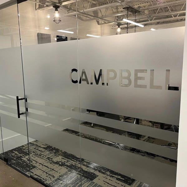 Custom window frosting with cut-out logo for Campbell by Signarama Roswell