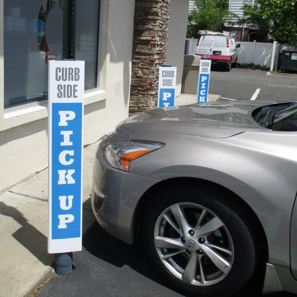 Parking Sign Covering Parking Pole