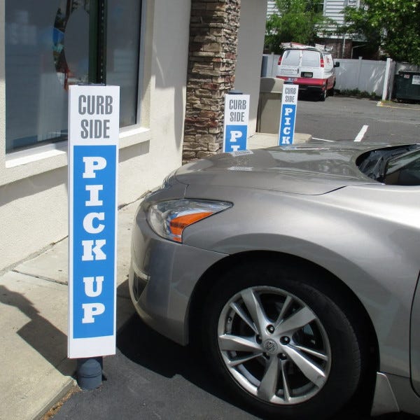 Parking Sign Covering Parking Pole