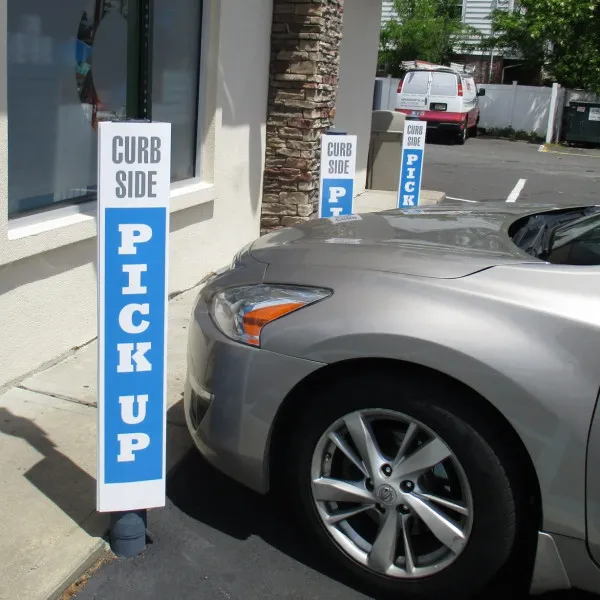 Parking Sign Covering Parking Pole