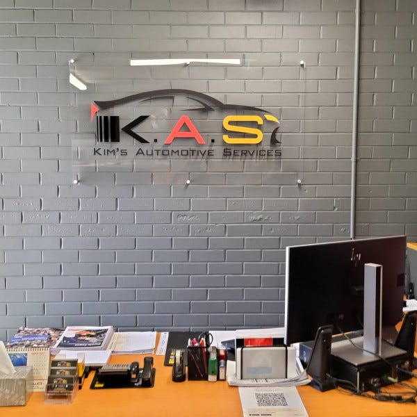 Kims Automotive Reception Sign
