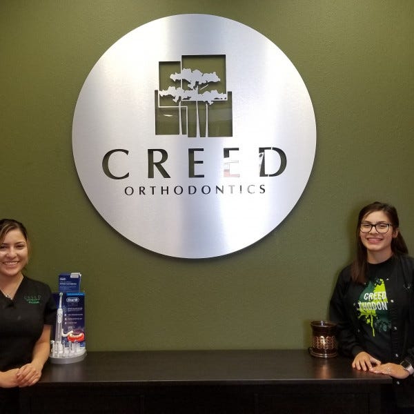 Routed Metal Lobby Sign At Creed Orthodontics - Cypress, TX