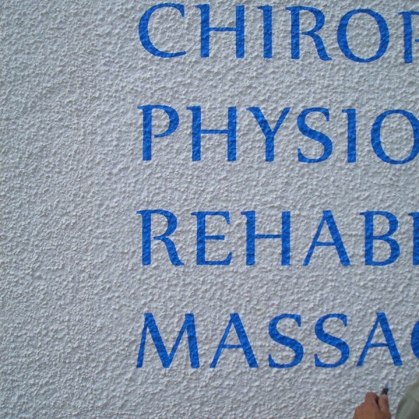 External wall text on textured wall