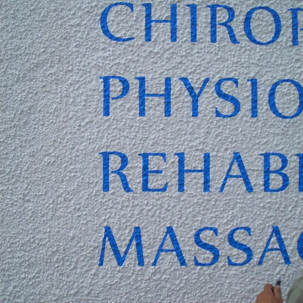 External wall text on textured wall