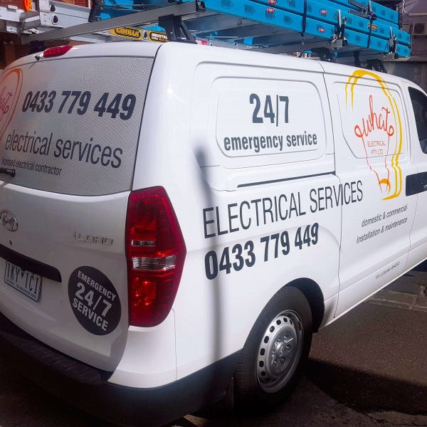 Electrical company van signage with van lettering.