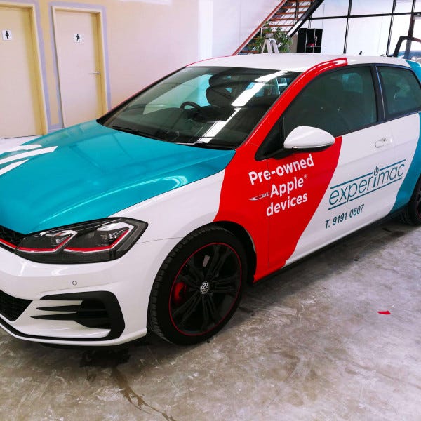 Full car wrapped in bright red and blue branding | Vinyl wraps