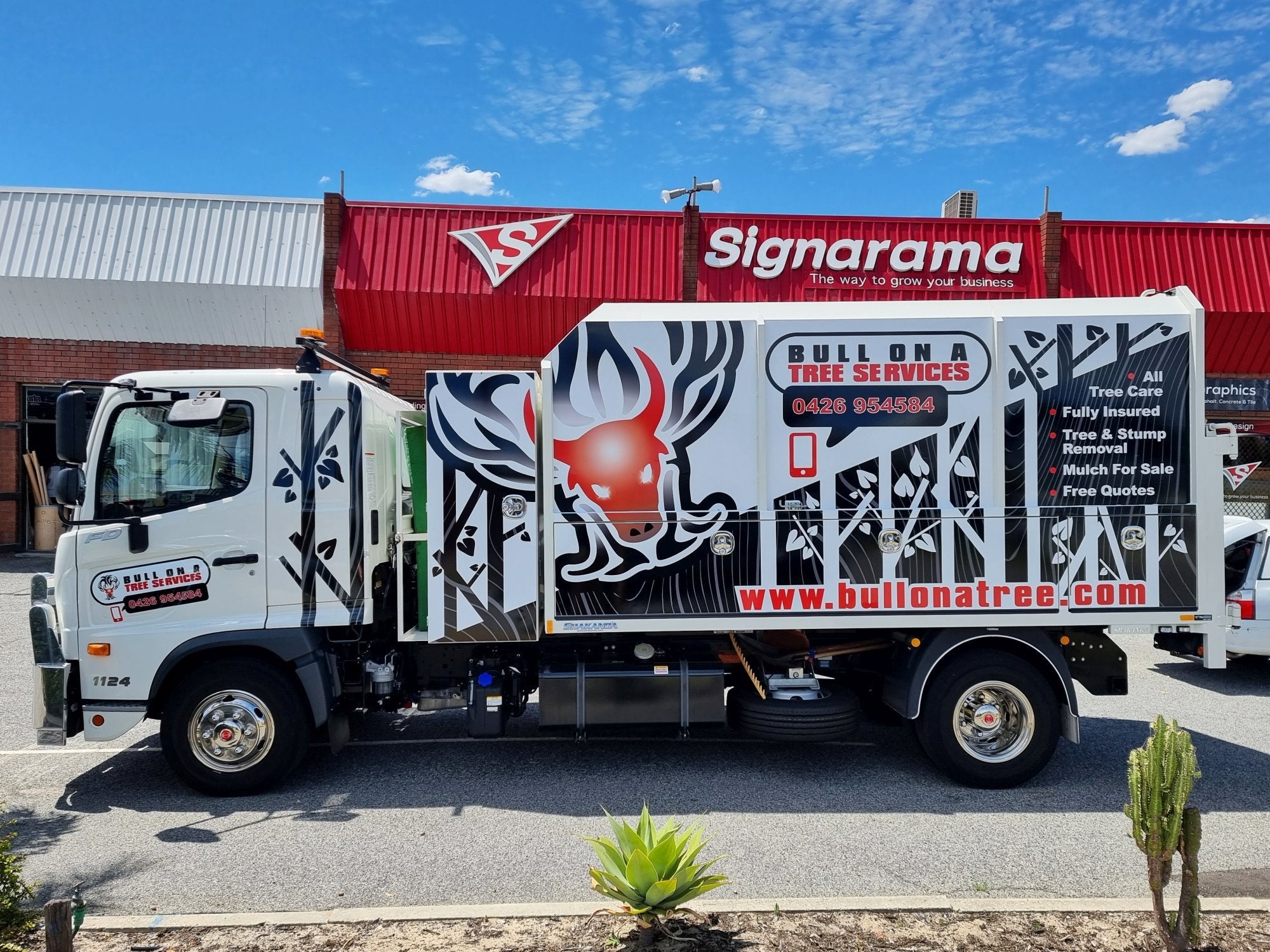 Bull On A Tree Truck Wrap