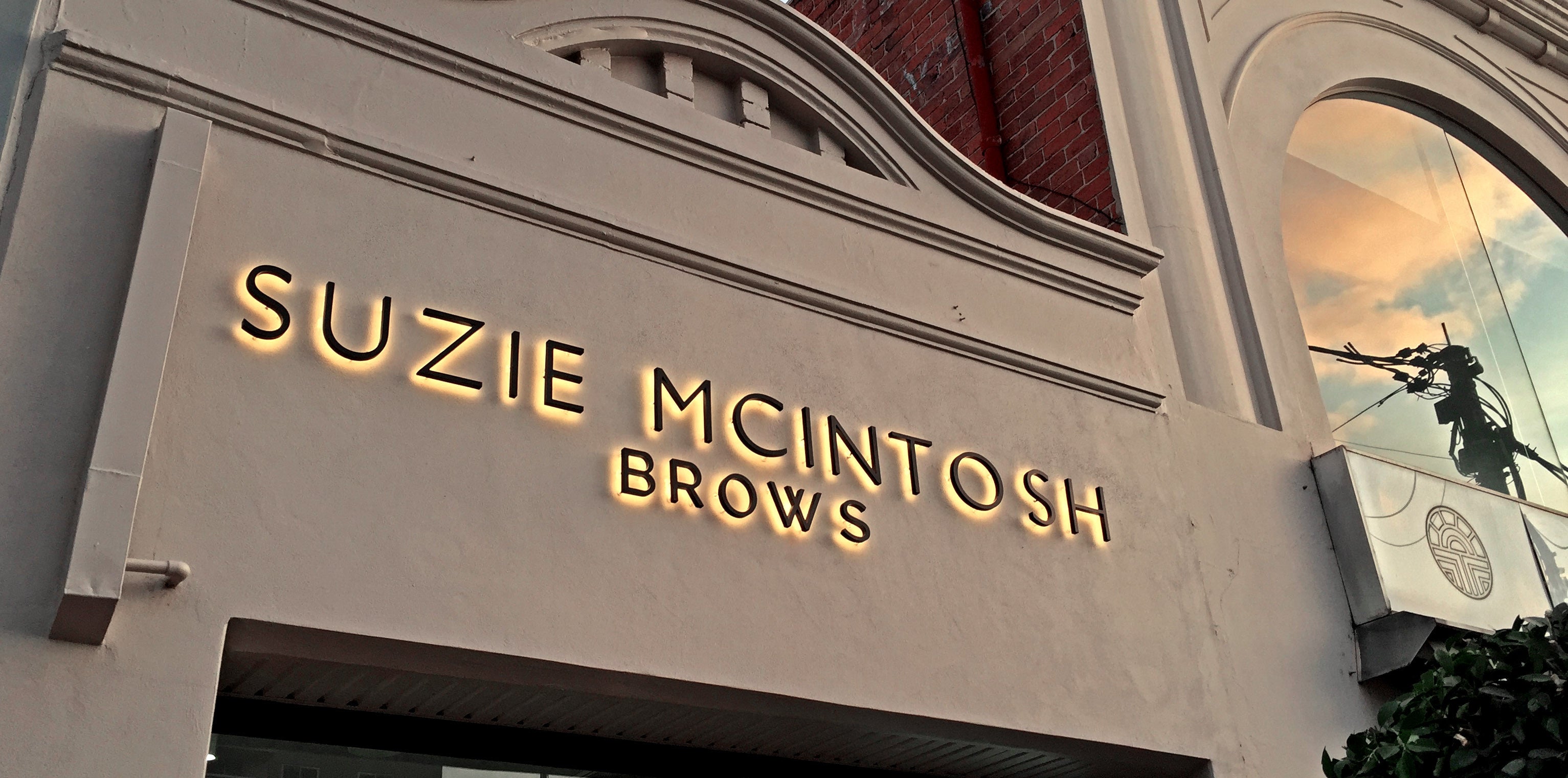 3D Illuminated Letters black with gold halo lighting on stone