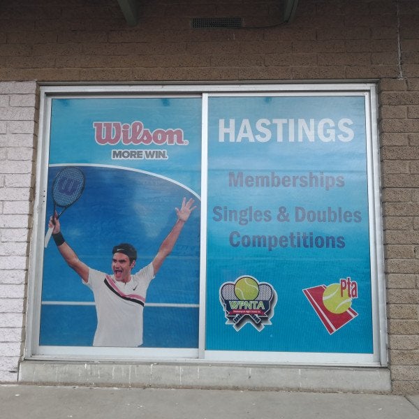 One Way Vision Window for a tennis club house with blue branding and tennis images