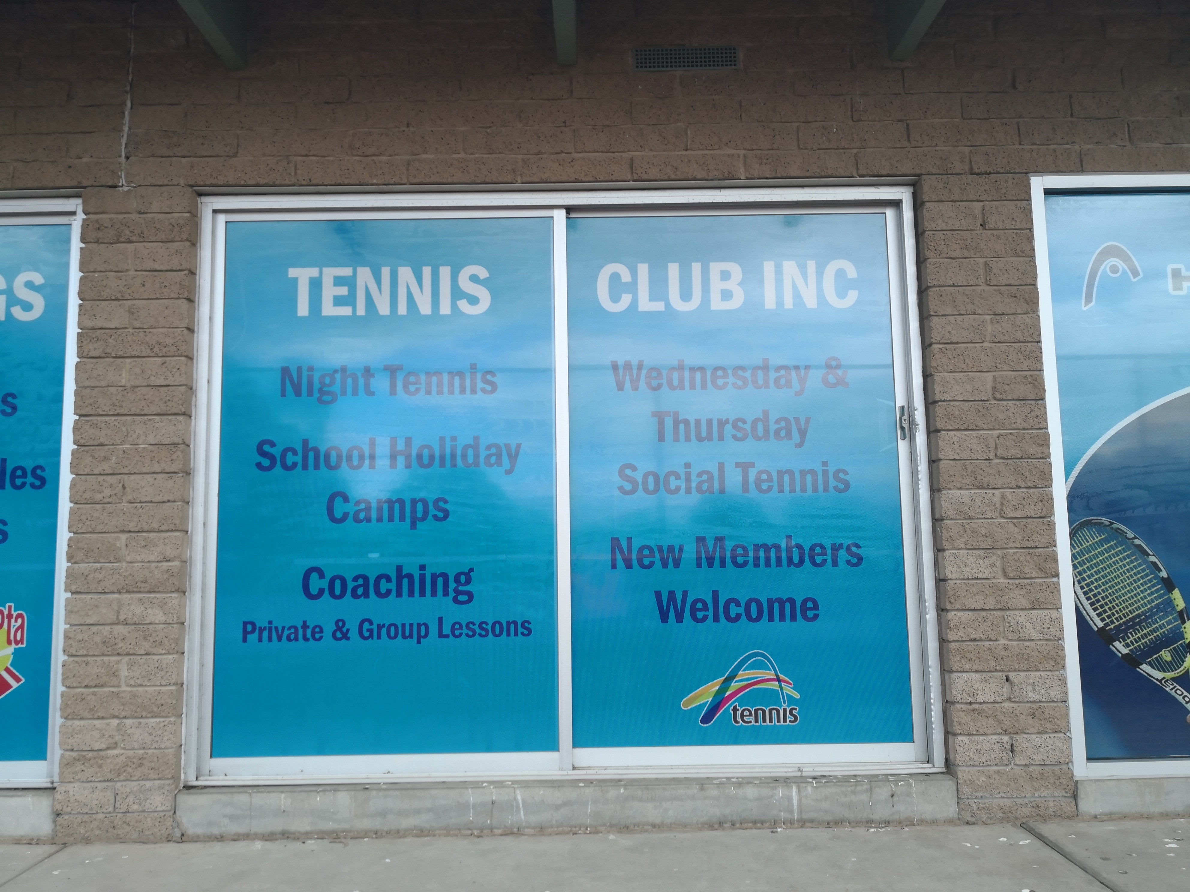 One Way Vision Windows for a tennis clubhouse. The graphics are branded blue
