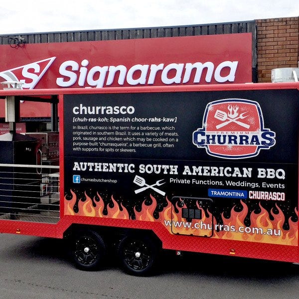 A food trailer with full wrap signage by Signarama