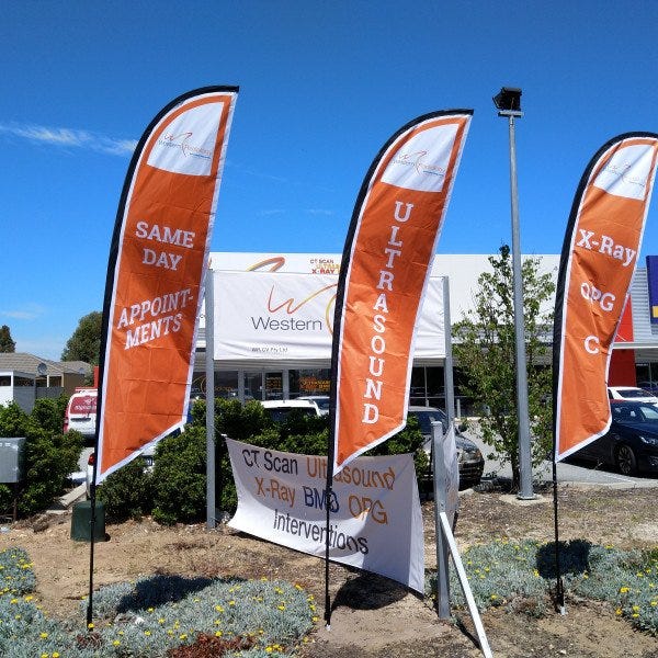 Teardrop Banners & teardrop flags that are orange and white for healthcare practice