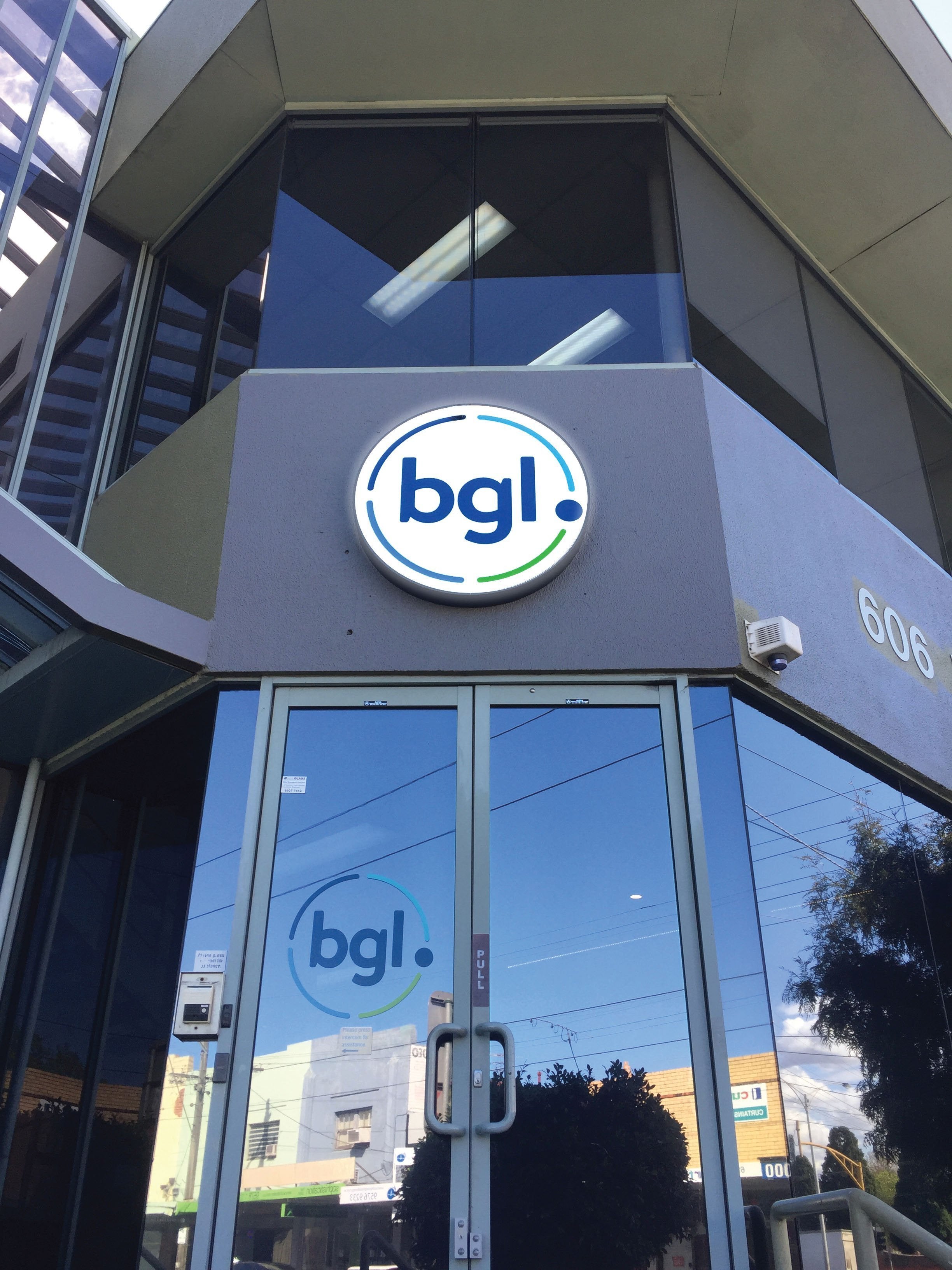 Circular light box for business entrance | Signarama