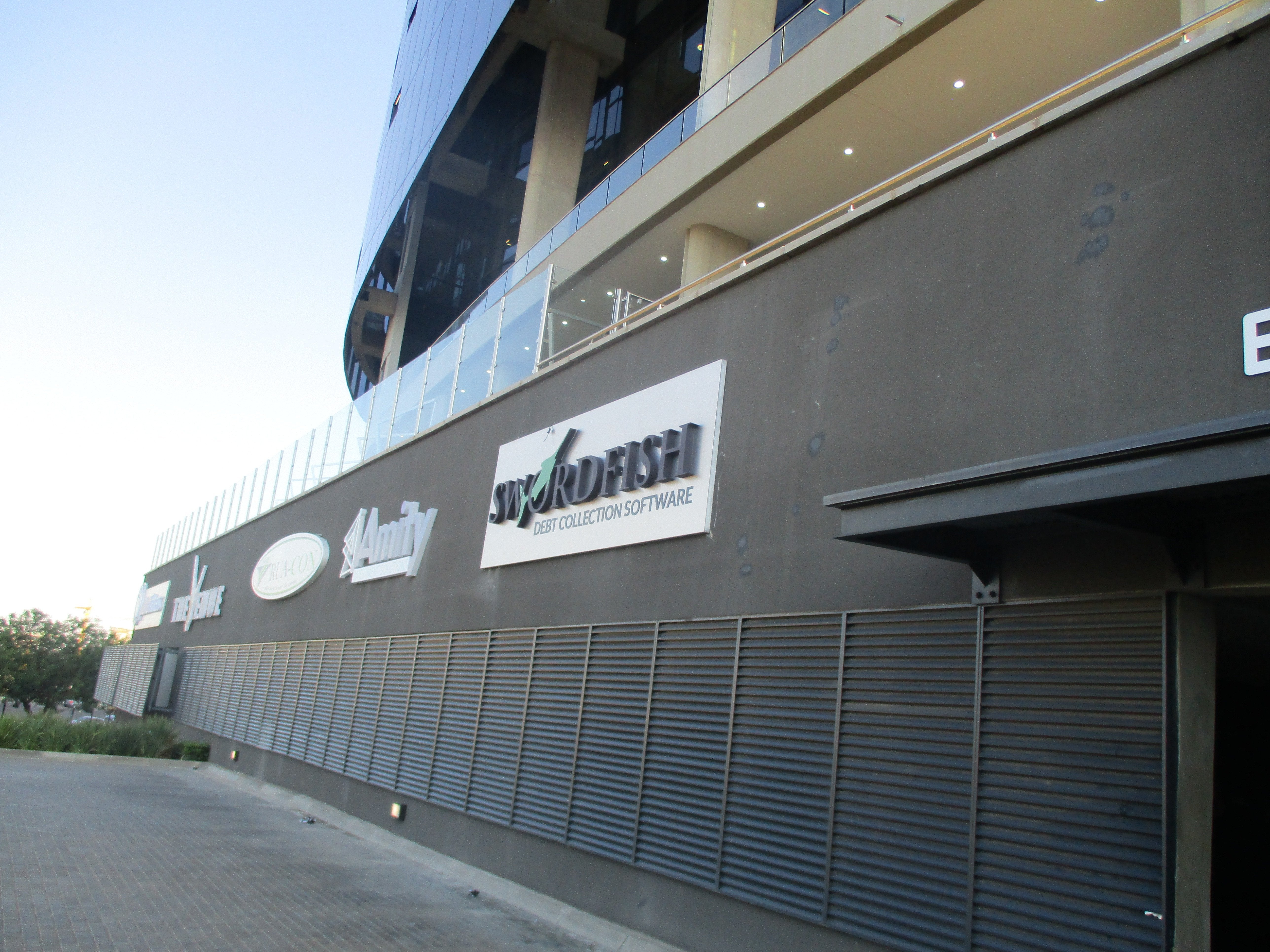 3 Dimensional fabricated illuminated letters logo day night acrylic on brushed aluminium composite