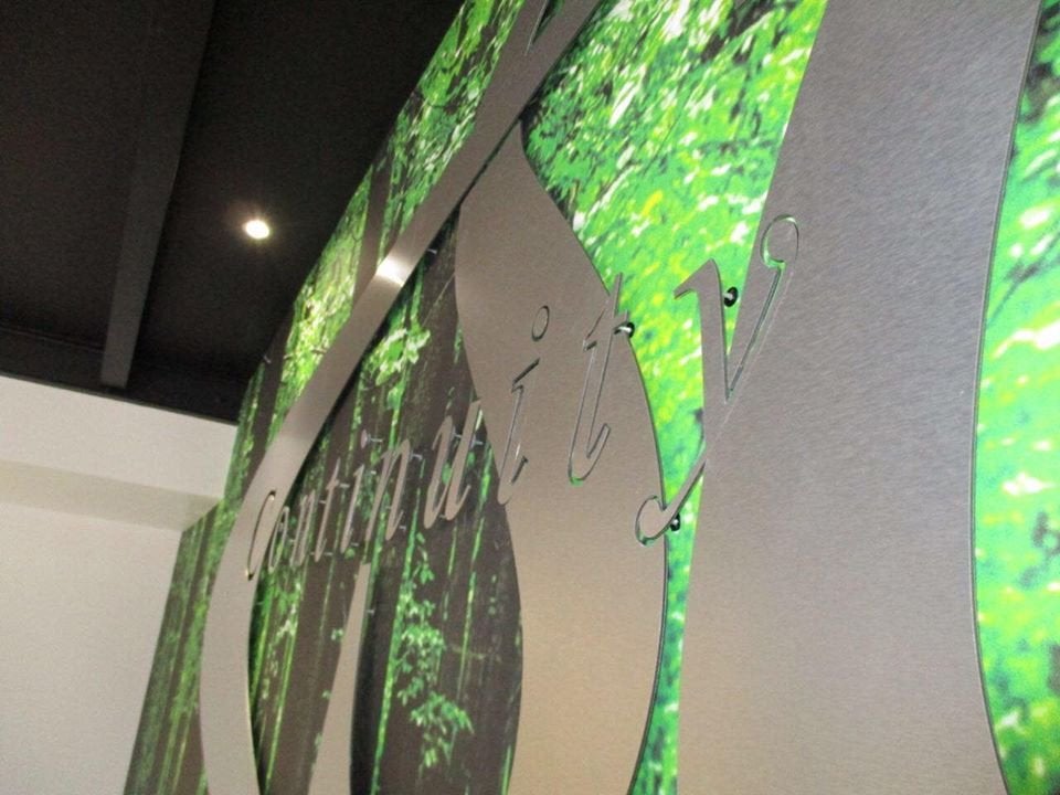 Cut brushed 3mm aluminium pinned of custom printed wallpaper