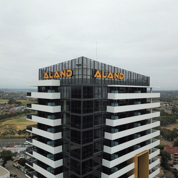 Building sign installed at the top of a new building | Business Signage | Signarama