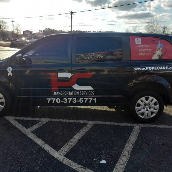 Pope Cares Vinyl Graphics and Window Perforation