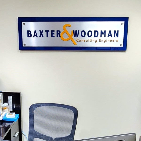 second-surface painted acrylic backer with brushed aluminum laminate face and color match painted dimensional letters mounted with standoffs