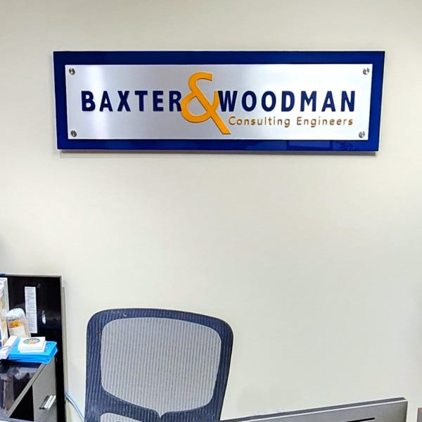 second-surface painted acrylic backer with brushed aluminum laminate face and color match painted dimensional letters mounted with standoffs