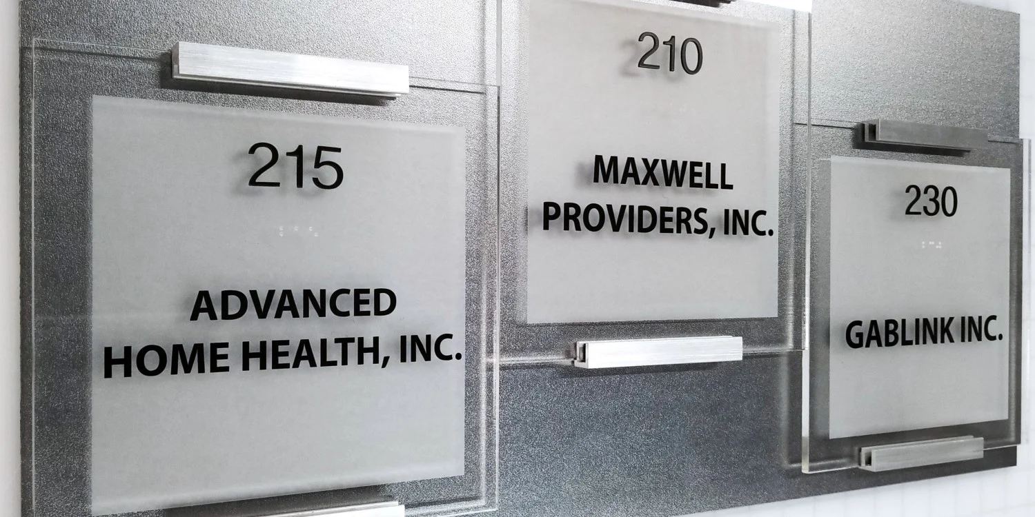 custom acrylic with cut black vinyl and custom mounting door signs