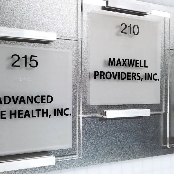 custom acrylic with cut black vinyl and custom mounting door signs