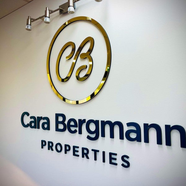 A Touch of Class for Cara Bergmann Properties with Mirror Gold Laser Cut Logo