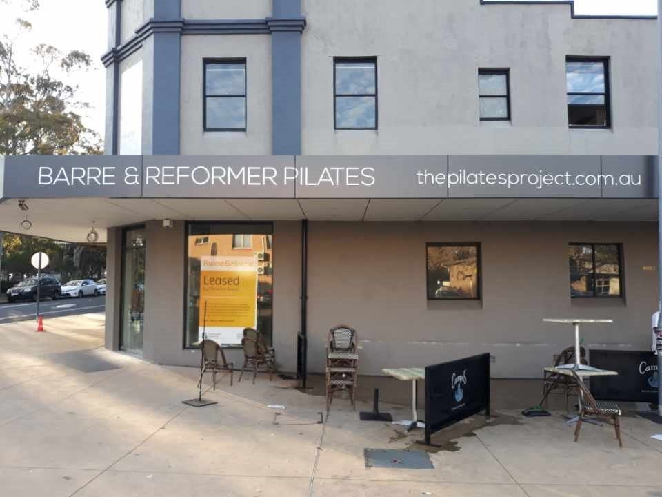Awning Signs, wall signs and window at The Pilates