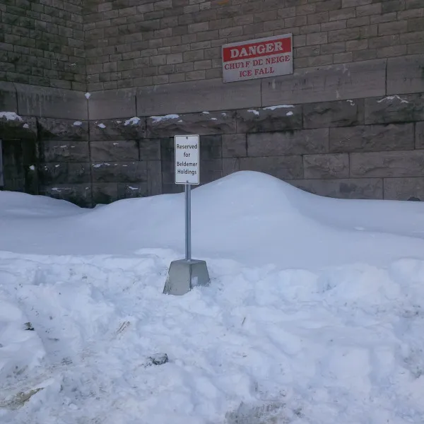 6ft high post with concrete signs