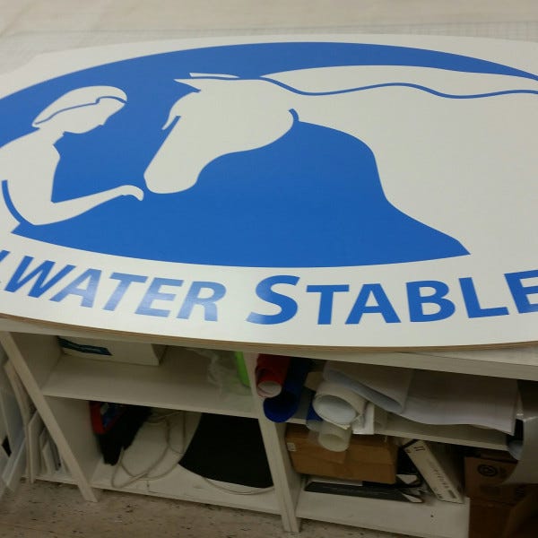 wood cut sign-vinyl graphics