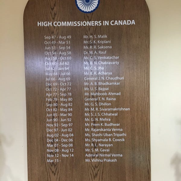 oak wood cut- stained- vinyl letters wall board-india embassy