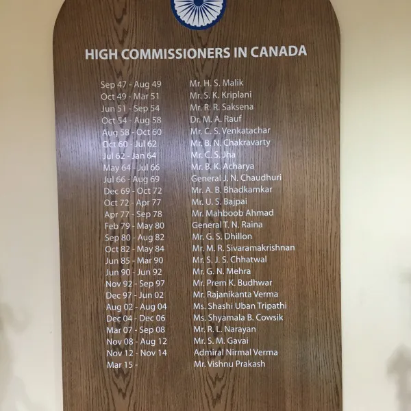 oak wood cut- stained- vinyl letters wall board-india embassy