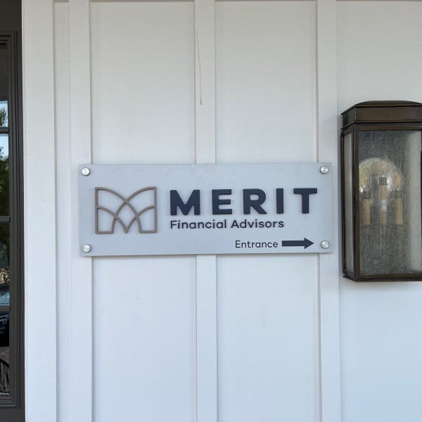 Acrylic standoff office sign with logo for Merit Financial Advisors