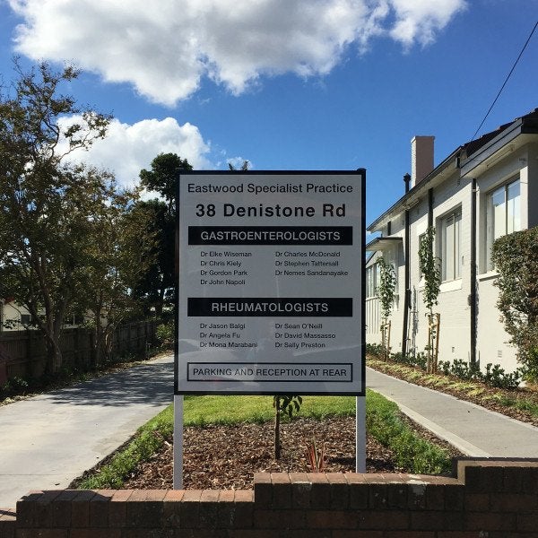 Black and white Metal Panel & Post Sign for healthcare practice | Signarama