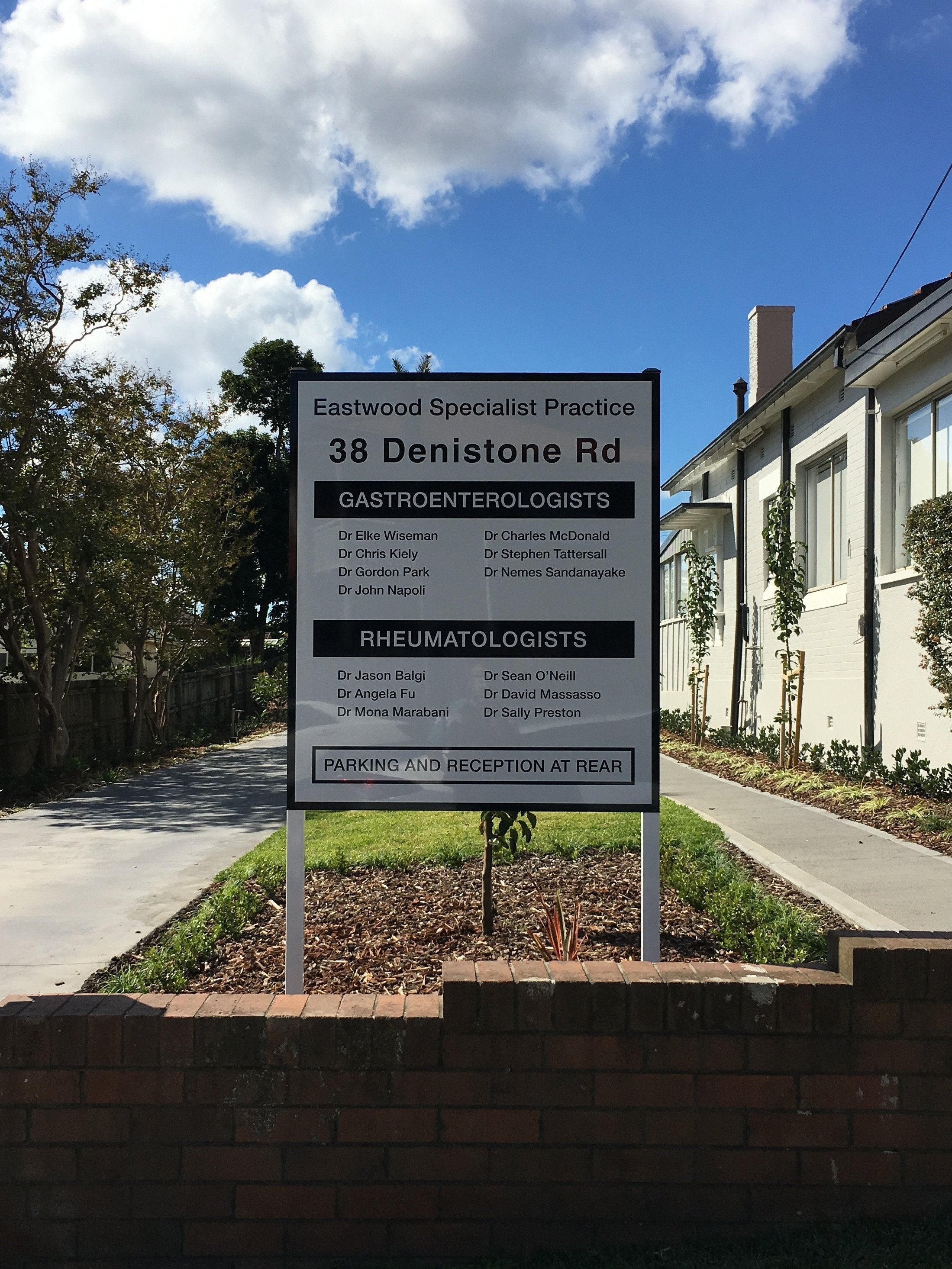 Black and white Metal Panel & Post Sign for healthcare practice | Signarama