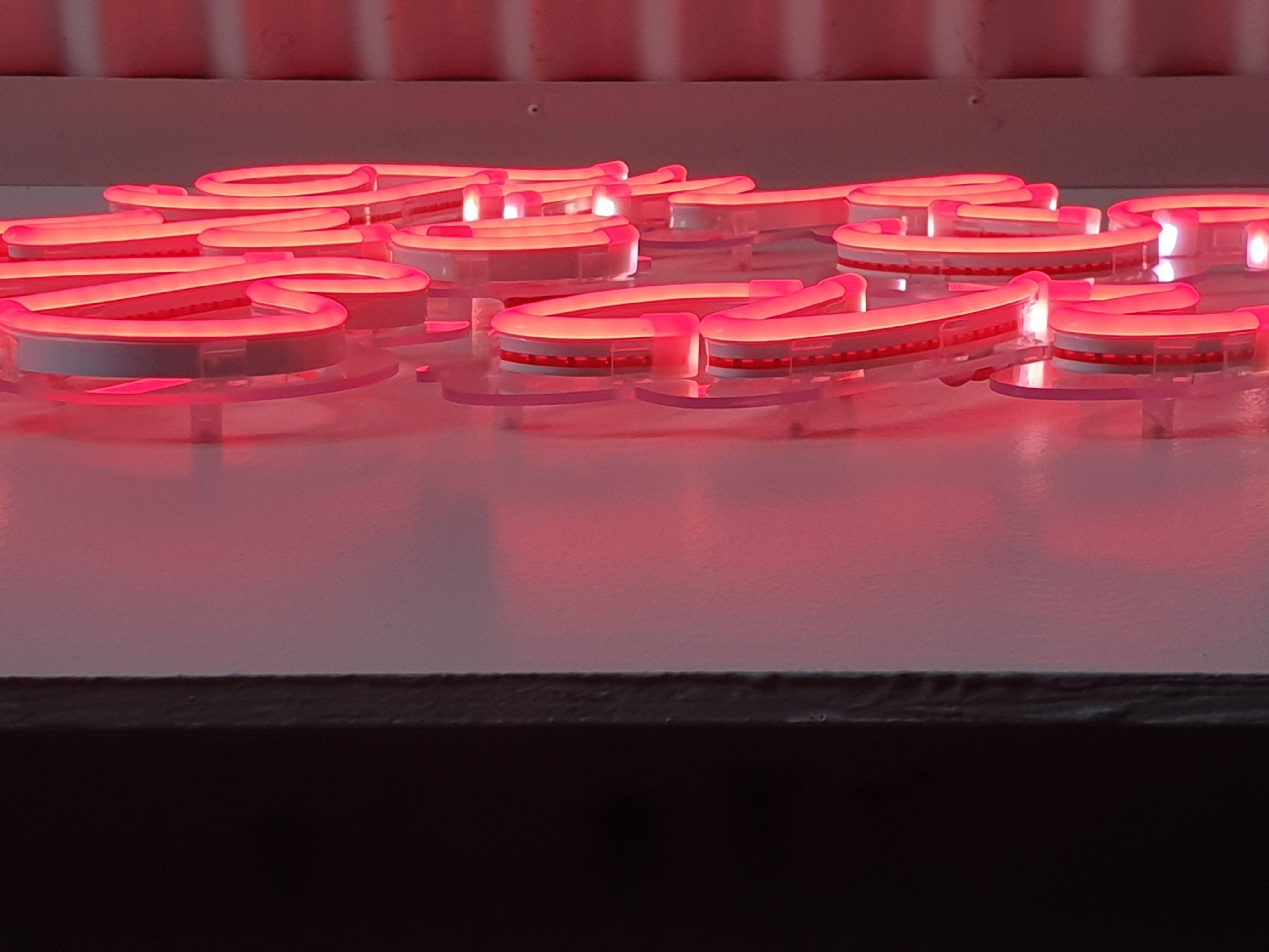 Pink neon flex tubing sign on clear acrylic | LED Neon Signs