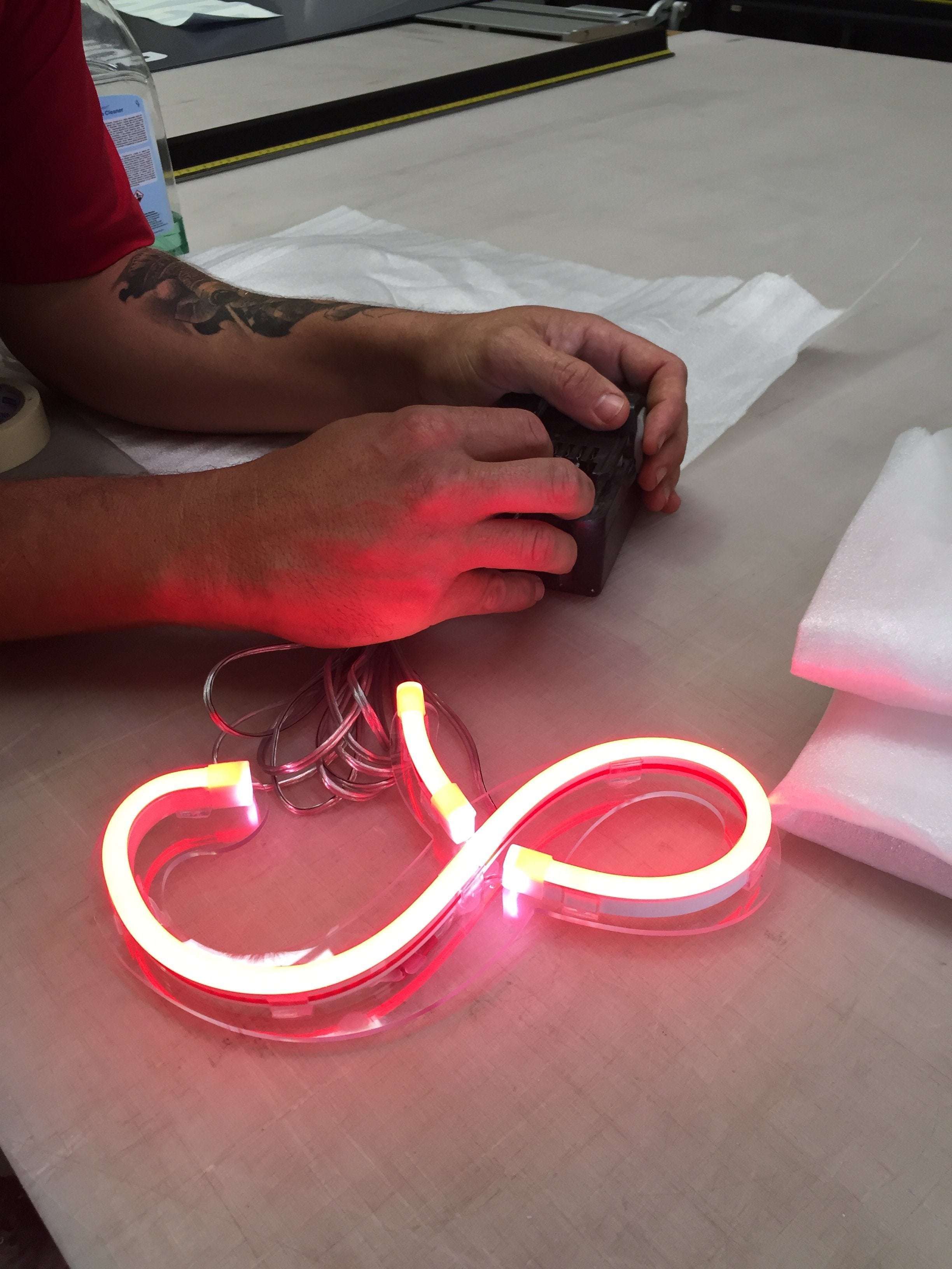 Red LED Neon Flex Sign being tested before install by Signarama Australia | Neon Signs