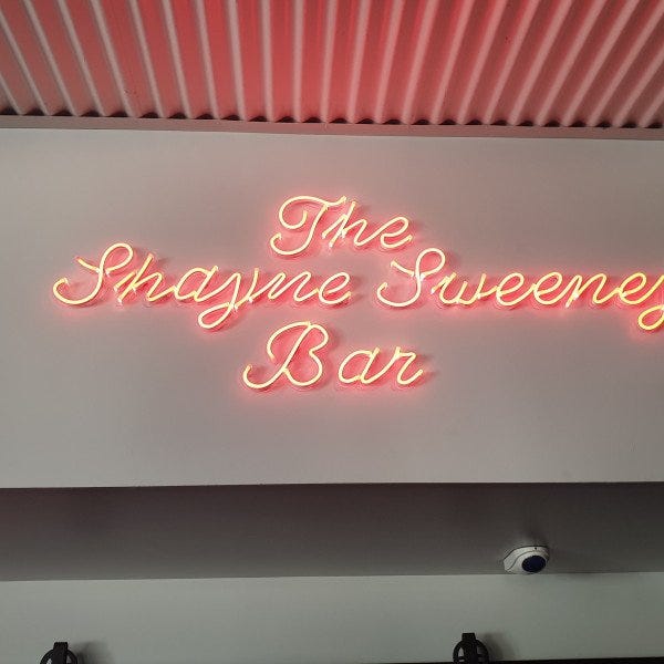 LED Neon Flex Sign with the text written out in cursive glowing red