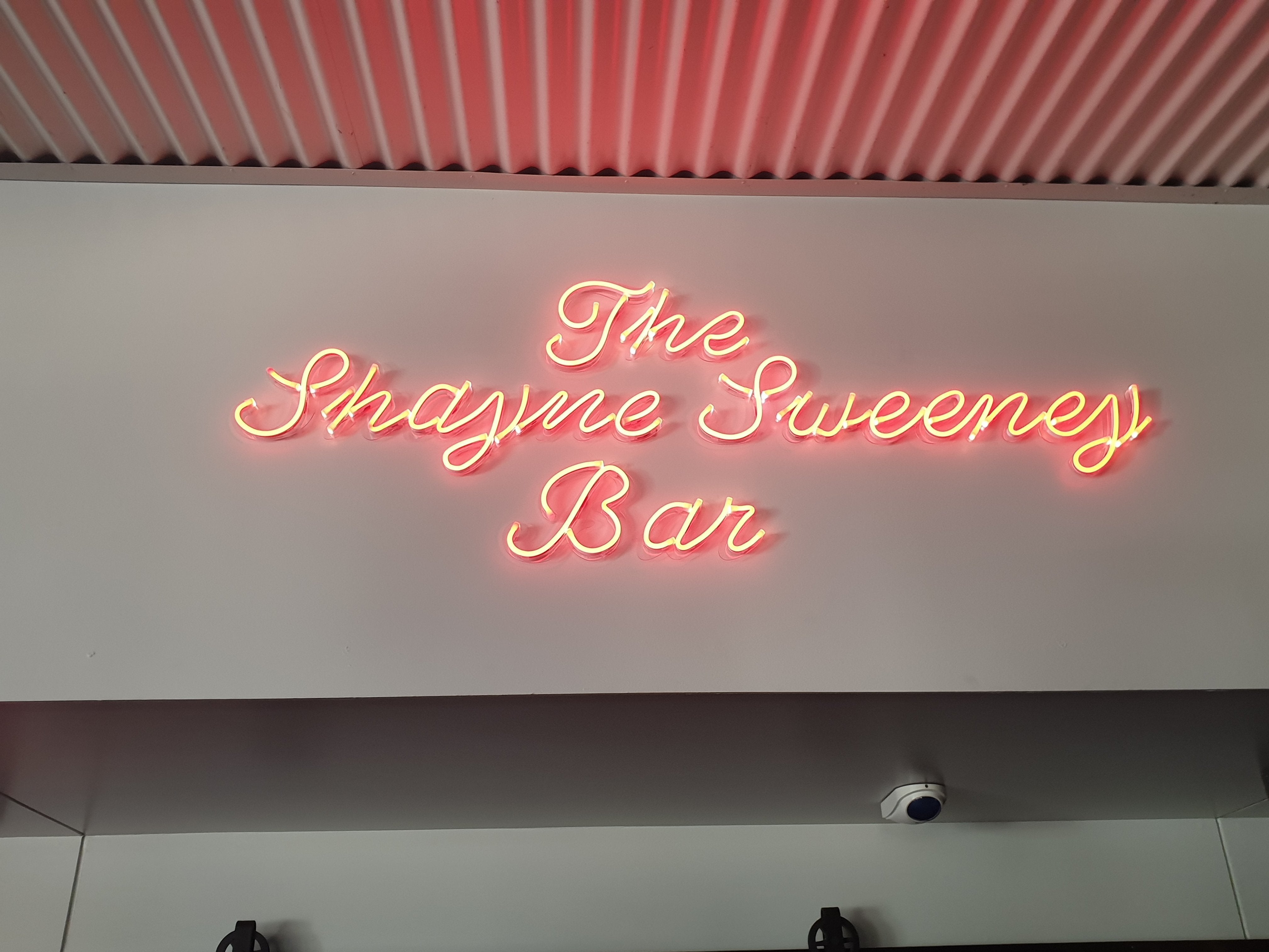 LED Neon Flex Sign with the text written out in cursive glowing red