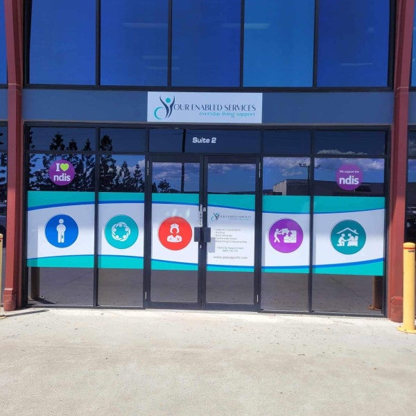 YES! Vibrant Window Graphics and New Building Sign Make Your Enabled Services Standout
