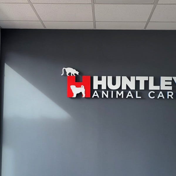 Huntley Animal Hosp Dimensional Logo and Letters