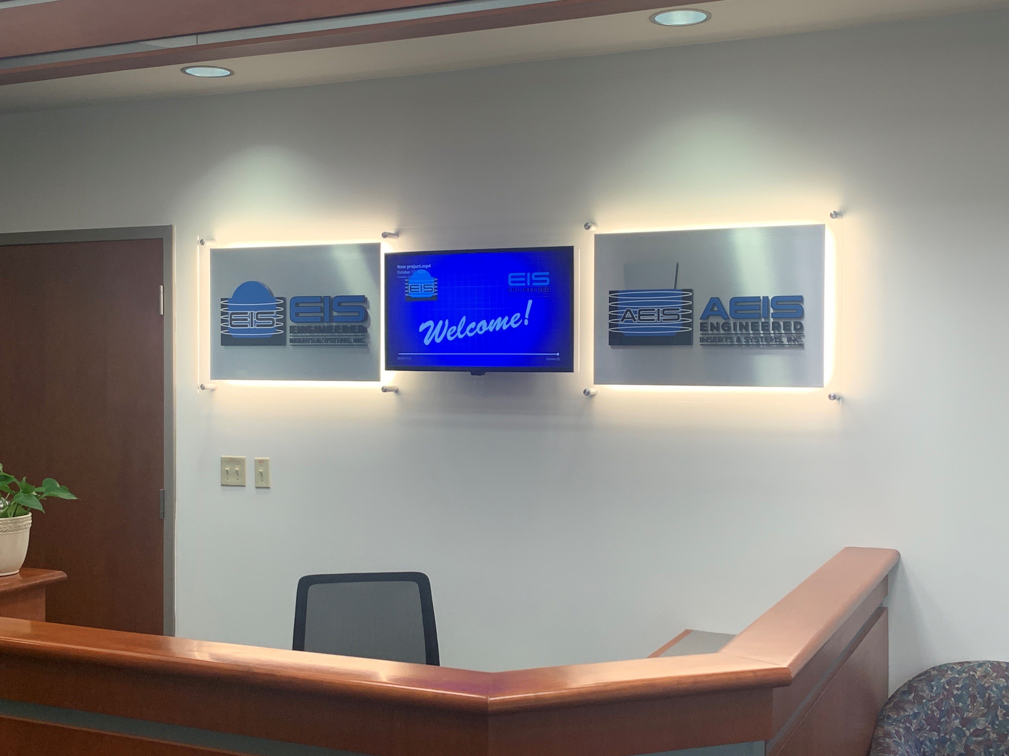 EIS's new reception desk signage, with LED lights and digital display