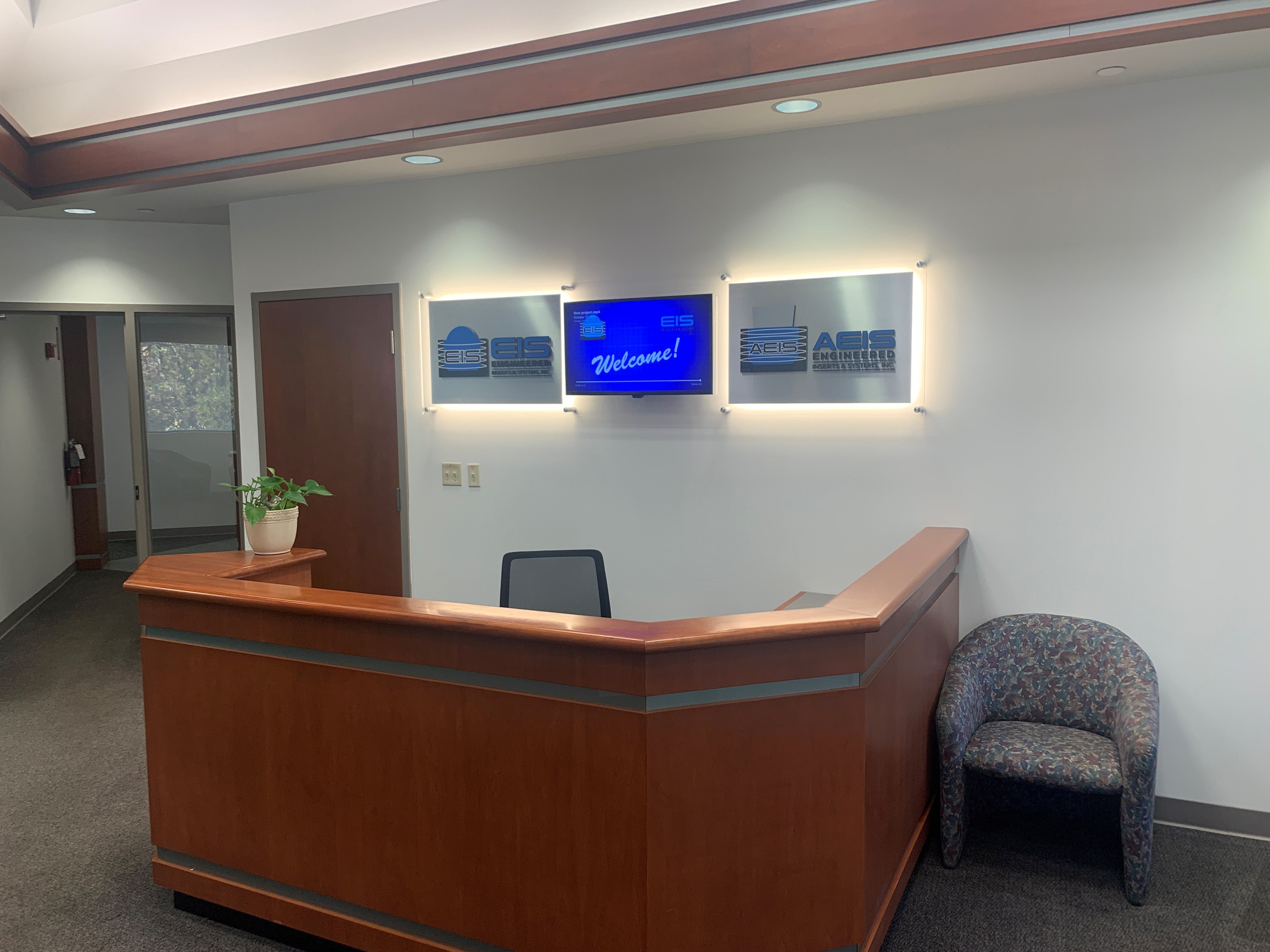EIS's new reception desk signage, with LED lights and digital display